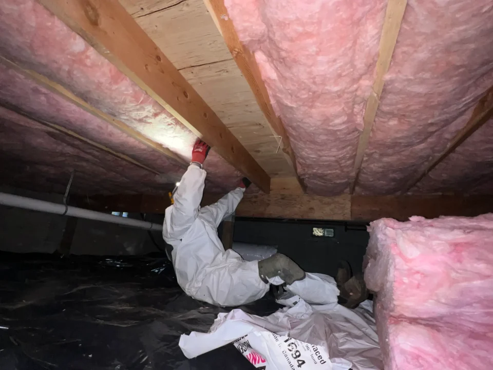 PNW Construction & Energy Services inspecting a crawlspace in a client's home.